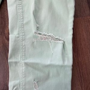 Old Navy mint colored destructed skinnies